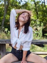 Skye Bloom Perching On A Picnic Table In The Park