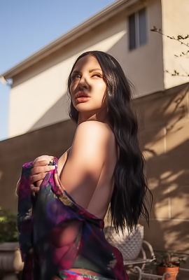 Carissa White Stands Sheer in Sunlit Garden